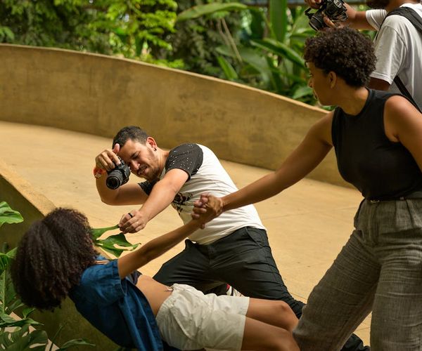 A diverse group of people smiling during a light activity.