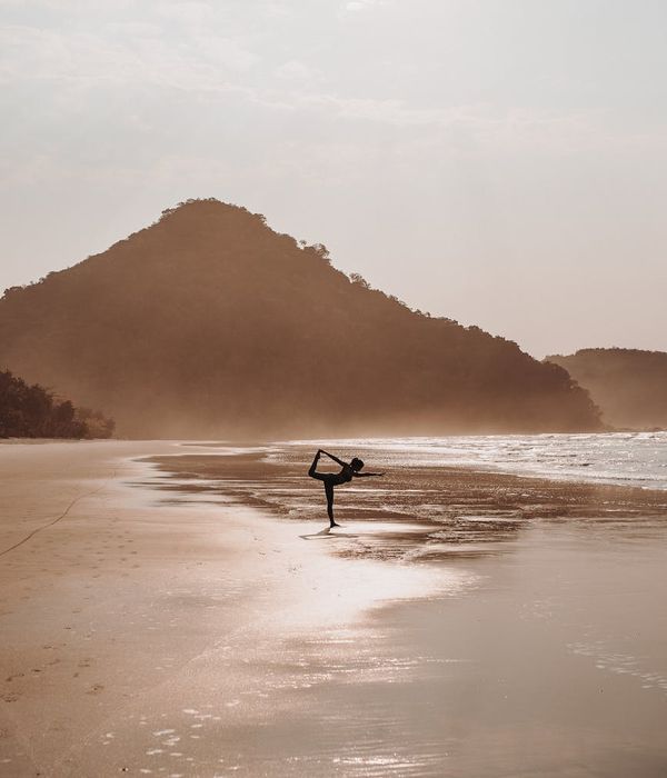 Woman in a calm yoga pose, embodying relaxation and peace.